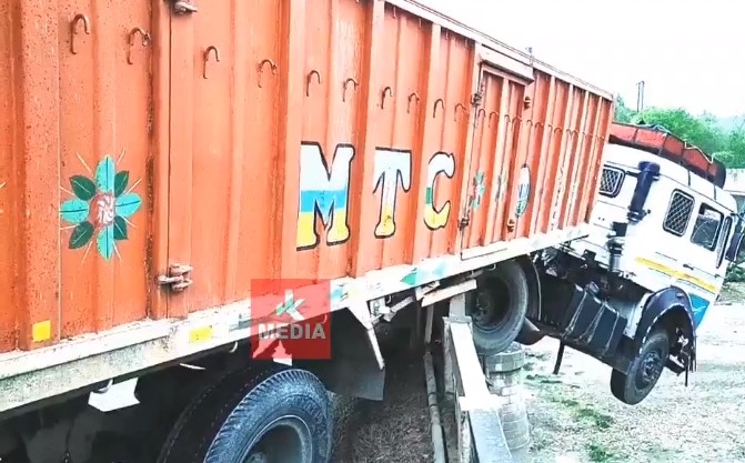 Truck dangling off the Basantar bridge after mishap in Samba