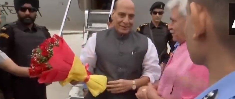 Defence Minister Rajnath Singh is being welcomed by LG Manoj Sinha and others at the Satwari airport in Jammu