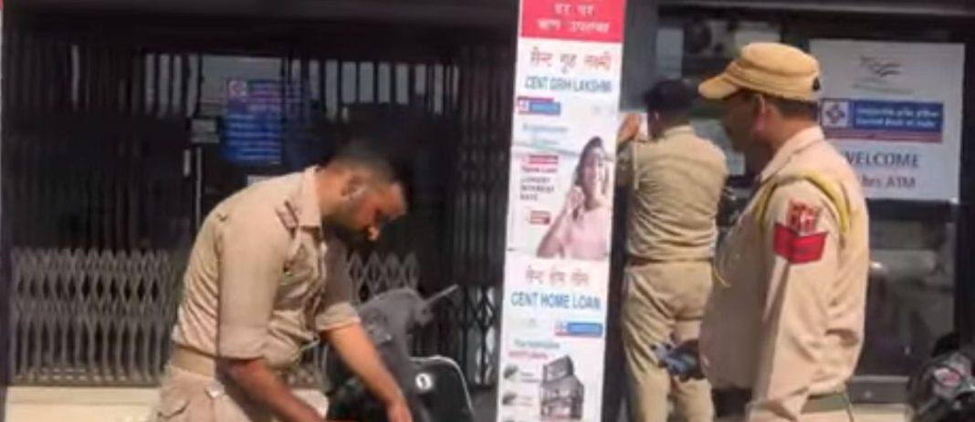 Bari Brahmana cops pasting posters regarding cyber-crime in Samba.