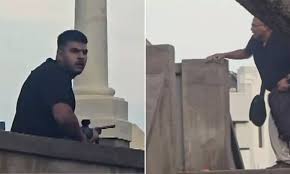 images - 2025-12-15T124100.032 Sydney, Dec 15: Police have identified the gunmen behind the deadly Bondi Beach shooting as a father-son duo from Lahore, Pakistan. The attack, which occurred during the ‘Chanukah by the Sea’ event, claimed 16 lives, including the elder shooter. Fifty-year-old Sajid Akram was fatally shot by police during the incident, while his 24-year-old son Naveed Akram was wounded and is receiving treatment at a hospital, New South Wales Police Commissioner Mal Lanyon confirmed. The victims ranged in age from 10 to 87 years. Bondi Beach shooters identified as Pakistani-origin father-son duo Following the attack, heavily armed police raided the family’s home in Bonnyrigg and an Airbnb property in Campsie. Authorities also discovered a vehicle containing several improvised explosive devices on Campbell Parade in Bondi. Commissioner Lanyon confirmed that the incident is being treated as a terrorist attack. The Joint Counter Terrorism Team (JCTT), comprising state and federal agencies, believes the attackers pledged allegiance to the Islamic State. Two IS flags were recovered from the attackers’ car, one of which was visible on the vehicle’s bonnet in footage from the scene. ASIO had previously taken an interest in Naveed Akram in 2019 after foiling plans for an IS-inspired attack, though he was later assessed as not posing an ongoing threat. Investigators also found that Naveed had links with an IS operative currently serving a prison sentence for planning insurgent activities. Commissioner Lanyon said Sajid Akram had held a licensed firearm for the past 10 years. Naveed Akram, an unemployed bricklayer, reportedly lost his job two months ago. The family lives in a three-bedroom home in Bonnyrigg along with Naveed’s parents, sister, and brother. Naveed’s mother expressed shock over her son’s involvement, stating she could not recognise him in images from the scene and did not believe he was capable of such violence or extremist activity.